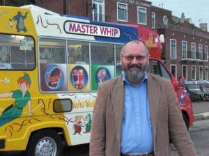 Master Whip Master Whip poses in front of his van